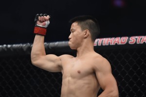 Nov 15, 2015; Melbourne, Australia; Ben Nguyen (red gloves) reacts as he competes against Ryan Benoit (blue gloves) during UFC 193 at Etihad Stadium. Mandatory Credit: Matt Roberts-USA TODAY Sports