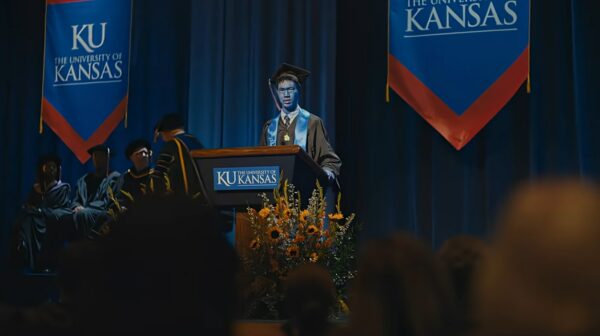 Allstate Check First Blue Man commercial, showing blue graduate from the University of Kansas